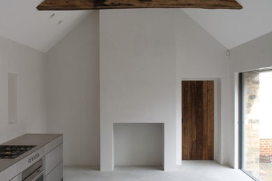 Expansive contemporary single-wall kitchen in Other with concrete flooring.