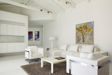 This is an example of a contemporary formal living room in Miami with white walls.