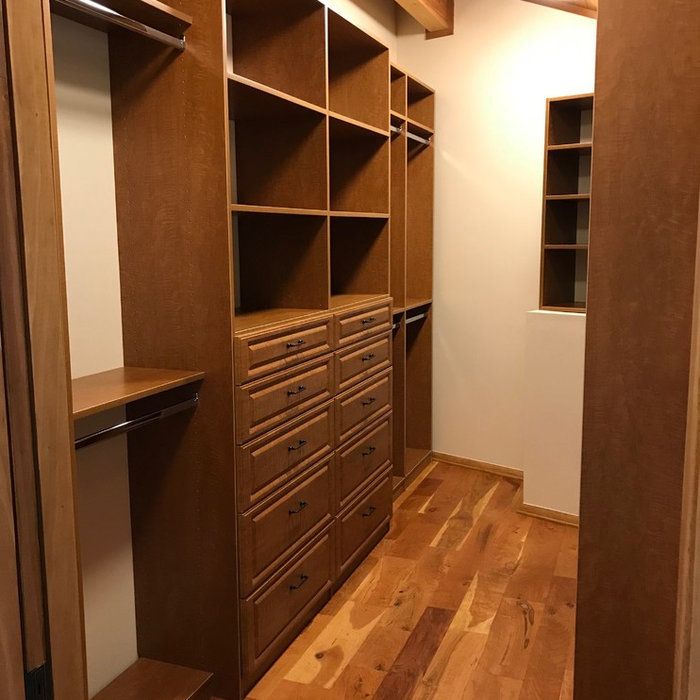This is a gorgeous closet designed using our Nina Maple color, NY style drawer fronts and accented with all oil rubbed bronze hardware. This spacious closet contains adjustable shelving, shoe shelves