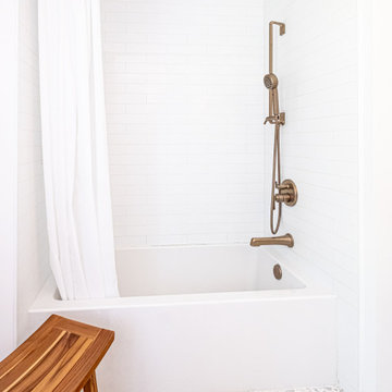 White Subway Tile Shower with Luxe Gold