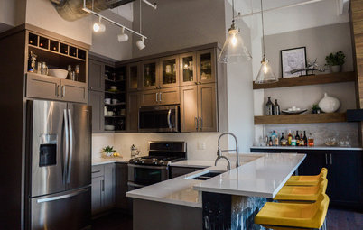 Gray Cabinets and a Wood-Wrapped Fireplace Update a Downtown Loft