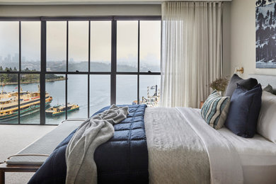 This is an example of a mid-sized contemporary master bedroom in Sydney with wallpaper.