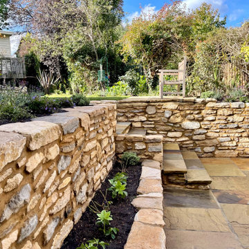Traditional cottage garden with natural stone walling