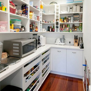 Inspiration for a large traditional u-shaped kitchen pantry in Brisbane with shaker cabinets, white cabinets, quartz benchtops, with island, a double-bowl sink, blue splashback, mosaic tile splashback, stainless steel appliances and dark hardwood floors.