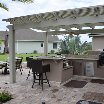 Outdoor Kitchen with pergola, knee wall, Big Green Egg and Evo.