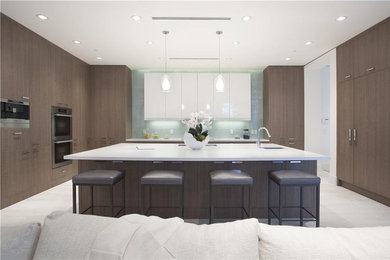Example of a large minimalist single-wall porcelain tile and gray floor open concept kitchen design in New York with an undermount sink, flat-panel cabinets, dark wood cabinets, stainless steel appliances and no island