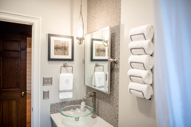 Bathroom - small modern master gray tile and ceramic tile ceramic tile and gray floor bathroom idea in New Orleans with furniture-like cabinets, gray cabinets, a one-piece toilet, gray walls, a vessel sink, quartz countertops and white countertops