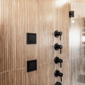 Modern Luxury Master Bathroom with Black Solid Surface Tub