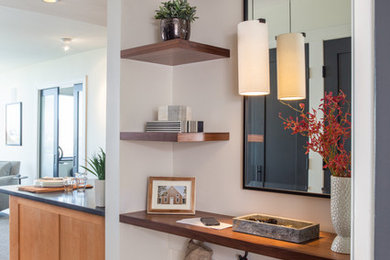Inspiration for a small transitional light wood floor foyer remodel in Boston with beige walls