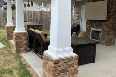 Inspiration for a mid-sized mediterranean backyard concrete patio remodel in Raleigh with a fireplace and a gazebo