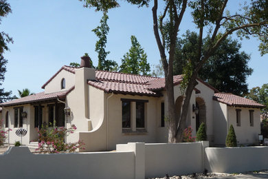 Mid-sized southwest beige one-story stucco gable roof photo in San Francisco