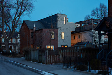 Small scandinavian three-story metal exterior home idea in Toronto