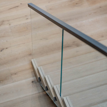 Electic Switchback Staircase with Glass Railing