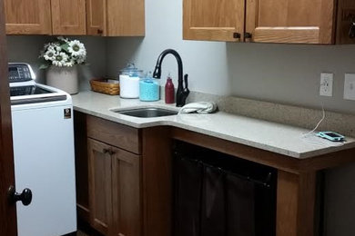 Example of an arts and crafts laundry room design in Cedar Rapids