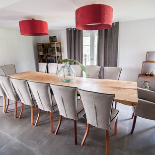 Design ideas for an expansive modern home office and library in Manchester with a wooden fireplace surround.