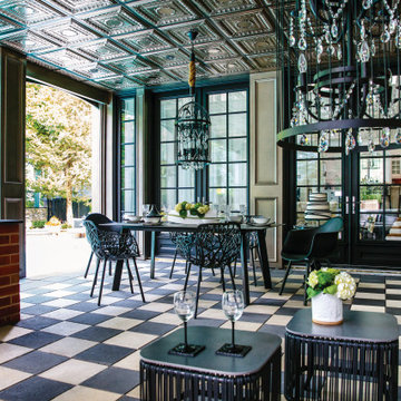 Traditional poolside paradise with grey and black pavers