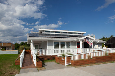 Example of a small arts and crafts gray one-story concrete fiberboard gable roof design in Denver