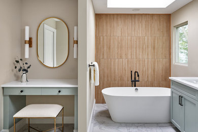 Inspiration for a large modern master brown tile and porcelain tile porcelain tile and double-sink bathroom remodel in Grand Rapids with shaker cabinets, blue cabinets, an undermount sink, solid surface countertops, a hinged shower door, white countertops and a built-in vanity