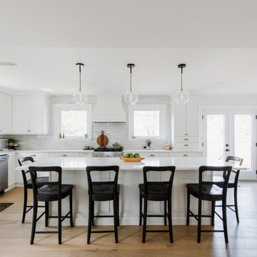 White shaker kitchen with island and brass hardware, Chesterfield