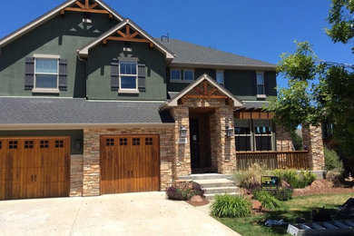 Large arts and crafts green two-story mixed siding gable roof photo in Denver