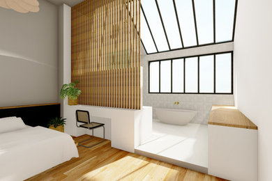 Exemple d'une grande chambre parentale tendance avec un mur blanc et parquet clair.