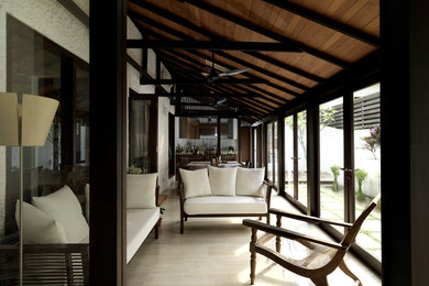 Living room - tropical living room idea in Singapore