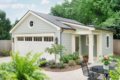 Example of a mid-sized detached two-car garage design in Louisville