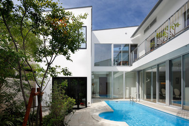 Inspiration for a contemporary courtyard custom-shaped lap pool in Tokyo Suburbs.
