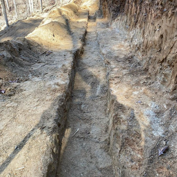 Retaining wall and rip rap rock installation