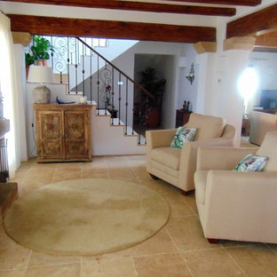 Design ideas for a small mediterranean open plan living room in Other with a reading nook, white walls, ceramic flooring, a freestanding tv and brown floors.