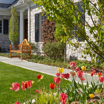 Bluestone Walkway with Tulips in Foreground and Wooden Giverny Bench