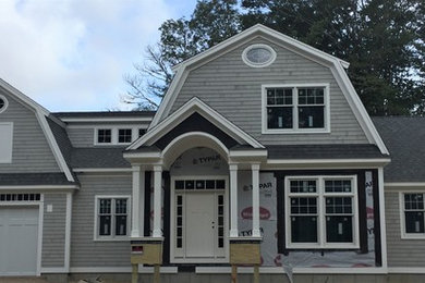 Gray two-story wood house exterior photo in Boston with a gambrel roof and a shingle roof