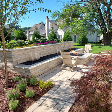 Contemporary Waterfall Wall Connected to the Gas Fire Pit