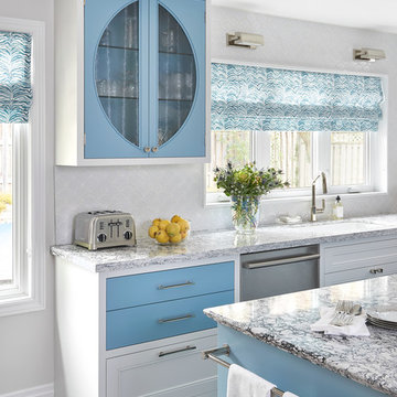 Blue Glass-Front Cabinet and Window Sink