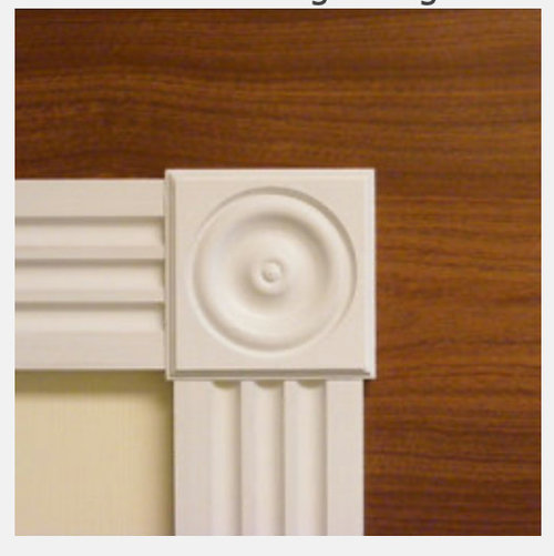 Fluted door and window trim with rosettes