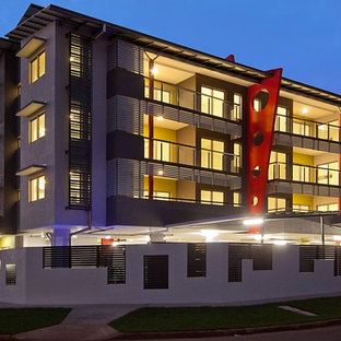 Example of a mid-sized minimalist home design design in Darwin