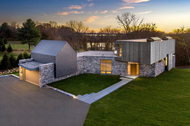 Huge modern gray three-story wood and clapboard exterior home idea in Bridgeport with a metal roof and a black roof