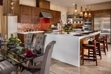 Example of a mid-sized u-shaped porcelain tile and gray floor eat-in kitchen design in San Diego with an undermount sink, flat-panel cabinets, dark wood cabinets, quartz countertops, metallic backsplash, matchstick tile backsplash, stainless steel appliances, an island and white countertops