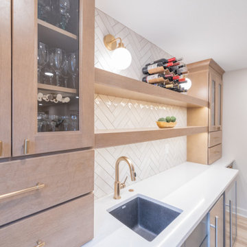 Warm & Inviting Basement Retreat with Custom Bar + Entertainment Center