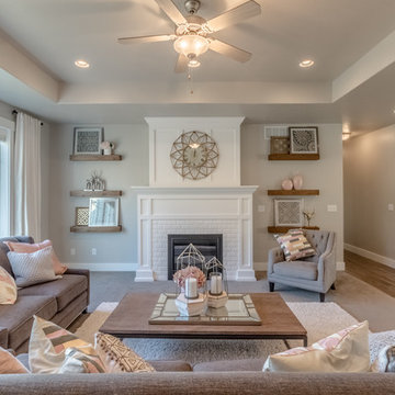 Living room with grand fireplace and entertainment center