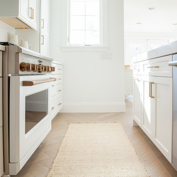 All White Transitional Kitchen with Herringbone Wood Floor