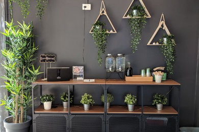 Inspiration for a large industrial kitchen/dining combo in Canberra - Queanbeyan with black walls, ceramic floors and grey floor.