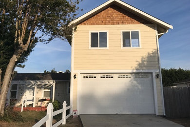 Inspiration for a mid-sized contemporary attached two-car garage workshop remodel in Other