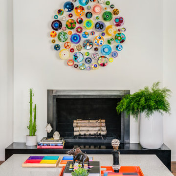 White Living Room with Fireplace + Colorful Glass Art