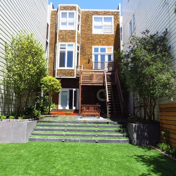 Artificial lawn areas save water and provide ample room for kisd and adults al