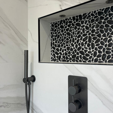 Black Pebble Mosaic in Shower Niche