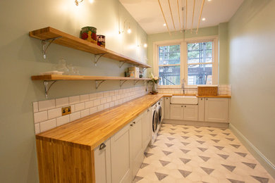 Traditional laundry room in Kent.