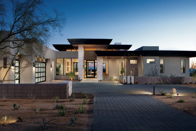 Contemporary one-story stucco exterior home idea in Phoenix