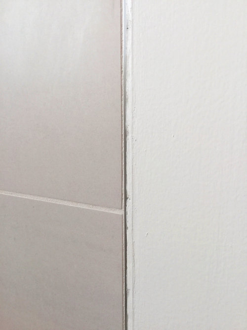 Unslightly transition from tile to drywall need advice