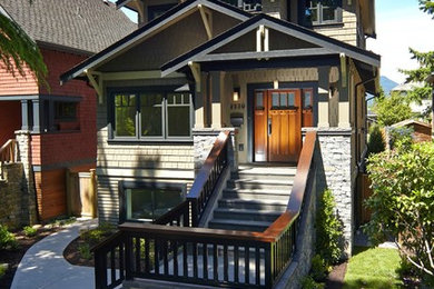 Large arts and crafts green three-story mixed siding gable roof photo in Vancouver
